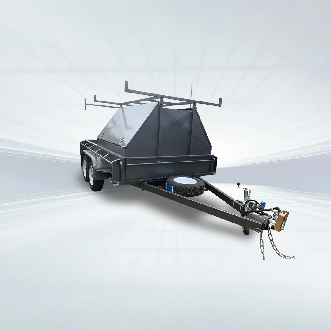 Studio side angled view of black 10x5 tradesman trailer with half canopy top and roof rack on white background.