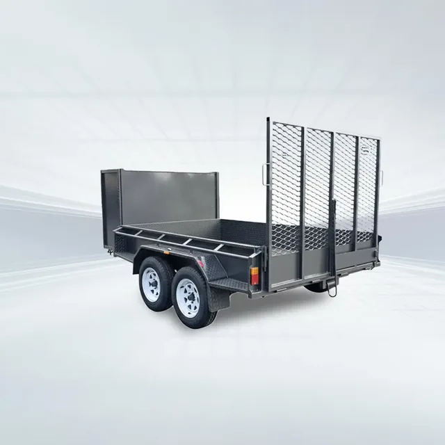 Side angled view of black 10x6 lawn mowing box trailer with full mesh ramp and checker plate deck in studio setting.