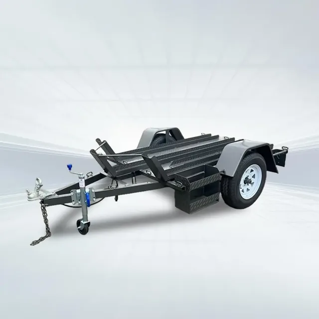 Grey 6x4 heavy-duty bike trailer with checker plate floor, tandem rails, 750kg GVM, and white wheels displayed in studio setting.