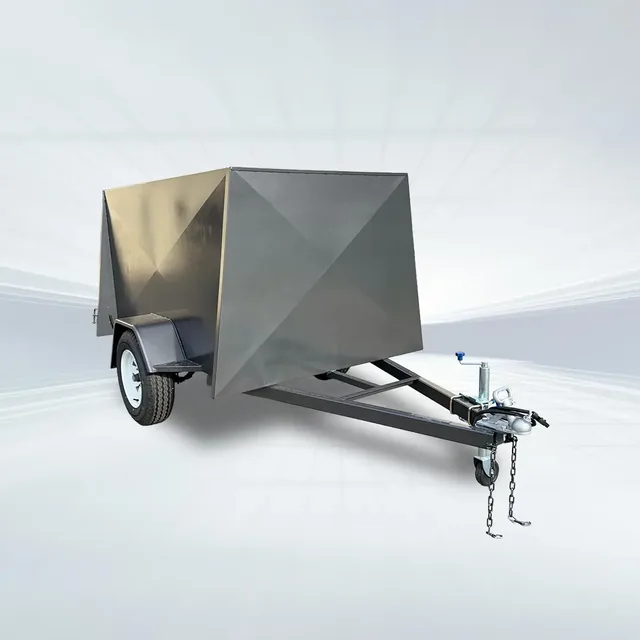 Studio shot of grey 6x4 enclosed trailer with 750kg GVM, 4ft internal height, and rear barn doors on white background.