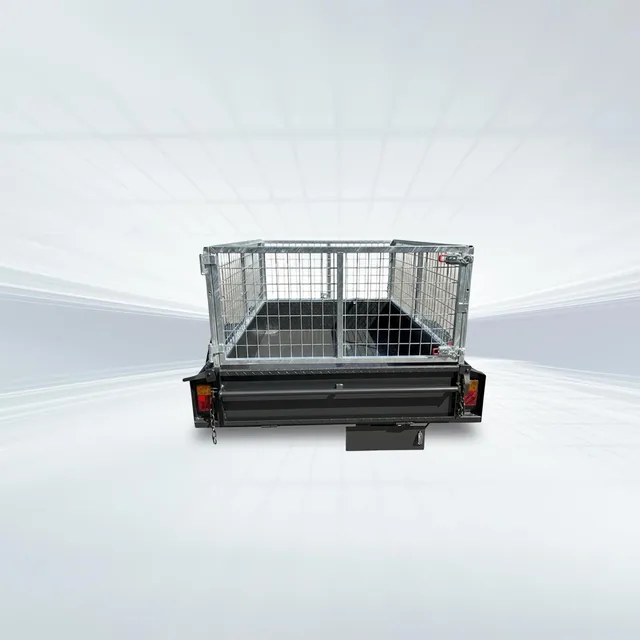 7x4 heavy-duty trailer with 750kg GVM, full checker plate floor, front/rear tailgates, and 600mm high galvanised cage in studio.
