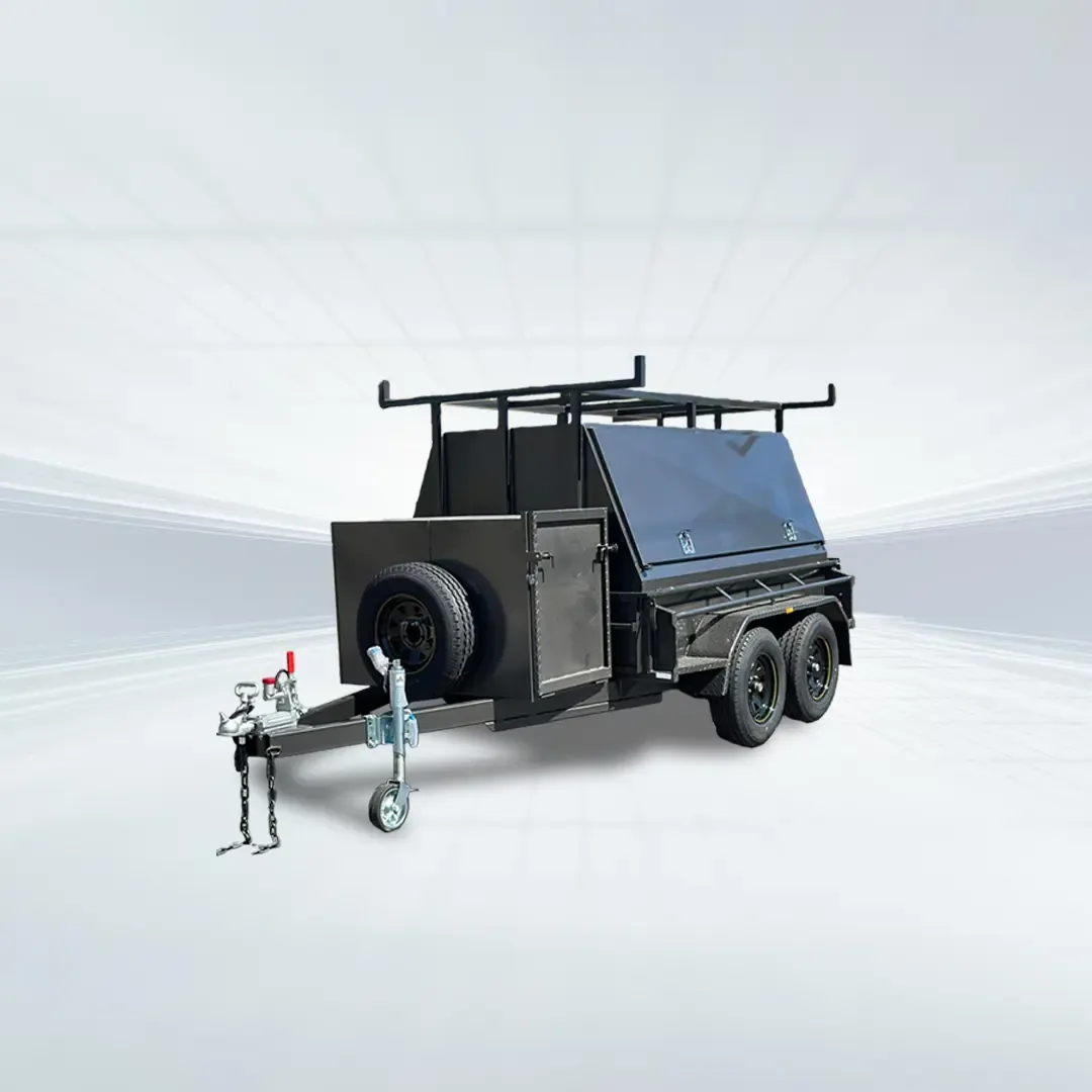 Studio side angled view of black 8x5 tradesman trailer with compressor box and full canopy on white background.