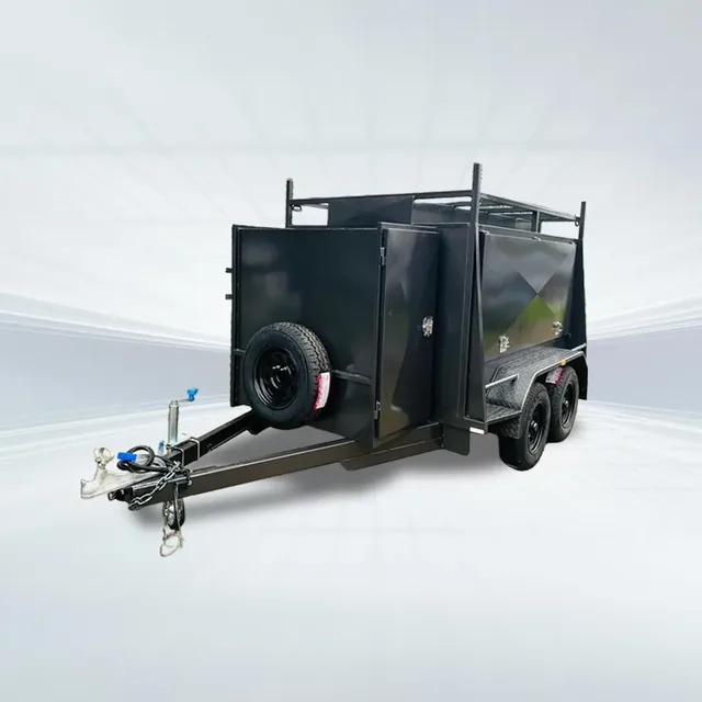 Studio side angled view of black 8x5 tradesman trailer with square one-piece canopy and compressor box on white background.